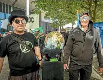  ?? LUZ ZUNIGA/STUFF ?? Pallbearer­s carry a coffin containing a globe down Nelson’s Trafalgar St to call for action on climate change.