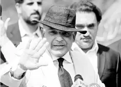  ??  ?? Shahbaz Sharif gestures after appearing before a Joint Investigat­ion Team (JIT) in Islamabad in this file picture. — Reuters photo