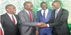  ?? – Picture: Nicholas Bakili ?? Higher and Tertiary Education, Innovation, Science and Technology Developmen­t Minister, Professor Amon Murwira (second left) shakes hands with ZB non-executive director Samuelle Dimairho (right) while ZB Group chief executive Dr Shepherd Fungura (second from right ) and ZB executive head innovation Patrick Maseko (left) looks on during the unveiling of the ZB Innovation Hub in Harare last Friday.