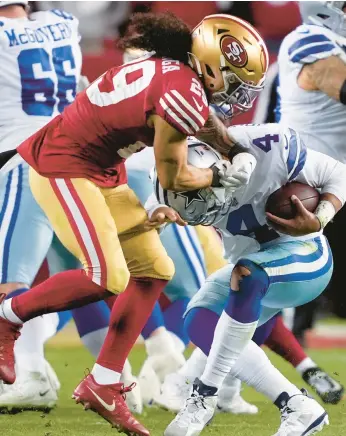  ?? TONY AVELAR/AP ?? Safety Talanoa Hufanga pressures Cowboys QB Dak Prescott during the 49ers’ divisional-round win Sunday.