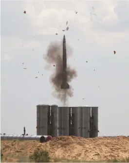  ?? (Sergey Pivovarov/Reuters) ?? A RUSSIAN S-300 air defense system launches a missile during military exercises at the Ashuluk shooting range near Astrakhan, Russia.