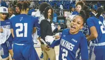  ?? ?? Elizabeth City State’s Naomi Lockamy celebrates with teammates after defeating Bowie State, 76-54, to advance to the semifinals of the CIAA women’s basketball tournament at CFG Bank Arena.