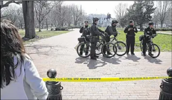  ?? ALEX BRANDON / ASSOCIATED PRESS ?? Secret Service officers stand in the cordoned-off Lafayette Park after a security incident near the fence of the White House in Washington on Saturday.. President Trump was not at the White House at the time of the incident.