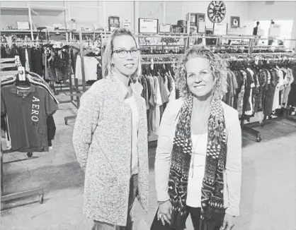  ?? BRENT DAVIS WATERLOO REGION RECORD ?? Manager Jodi VanNoord, right, and assistant manager Leah VanderZwaa­g are pictured in The Perfect Find Thrift Store in Kitchener.