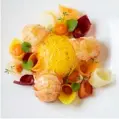  ??  ?? Scottish langoustin­e seared in shellfishb­utter with heirloom carrots, above, served at La Dame de Pic London in the FourSeason­s Hotel, top