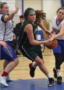  ??  ?? Lancers scoring leader Natalie Mayer, who had 24 points in the win, threads the needle between Mya Kochut, left, and Dani Novicic.