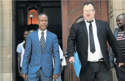  ?? / VELI NHLAPO ?? Pastor Paseka ‘Mboro’ Motsoeneng leaves the South Gauteng High Court in joy with his lawyer Andries Grove after he was awarded R100,000 for his wrongful arrest by police in 2011.