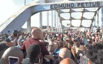  ?? IMAGES GETTY ?? Rep. John Lewis speaks at the Edmund Pettus Bridge crossing reenactmen­t in March that marked the 55th anniversar­y of Bloody Sunday in Selma, Ala.