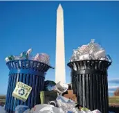  ?? WIN MCNAMEE/GETTY ?? Trash accumulate­s near the Washington Monument on Monday due to a partial government shutdown.