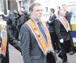  ??  ?? Nelson McCausland on the march as a long-standing member of the Orange Order
