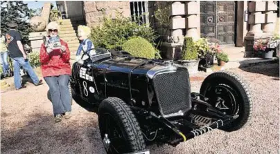  ??  ?? Freda McWhirter with the 1937 Jaguar SS100