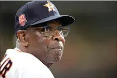  ?? DAVID J. PHILLIP / AP ?? Astros manager Dusty Baker Jr. looks at the scoreboard during the second inning against the Mariners on Tuesday in Houston.