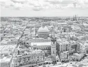  ?? DREAMSTIME ?? An aerial view of Our Lady of Mount Carmel Church and St. Paul’s Cathedral in Valletta, Malta.