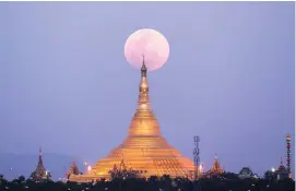  ?? Picture: AP Photo ?? CHERRY ON THE TOP: The moon rises behind a pagoda in Naypyitaw, Myanmar