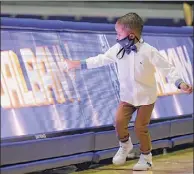  ??  ?? Tristan Killings, the son of new Ualbany men's basketball coach Dwayne Killings, plays near a sign at SEFCU Arena, where his dad was introduced Thursday. Killings was previously associate head coach at Marquette.