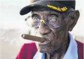  ?? PHOTO: REUTERS ?? Puffing for over 90 years . . . Richard Overton enjoys a cigar in 2017.