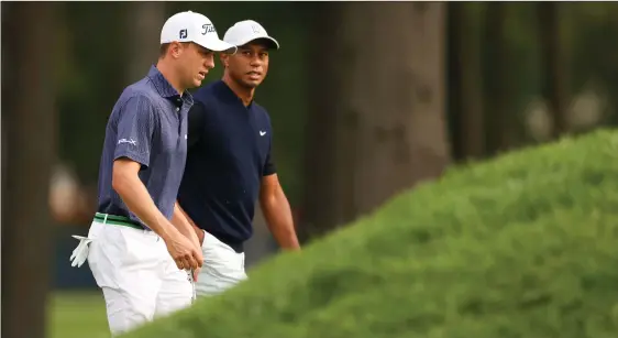  ??  ?? US Open leader Justin Thomas and three-time champion Tiger Woods played together yesterday with differing fortunes.