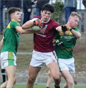  ??  ?? Barry O’Connor of St. Martin’s bursting past Byron Byrne and Peadair Cowman.