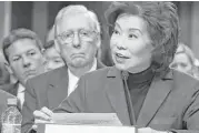  ?? Chip Somodevill­a / Getty Images ?? Elaine Chao, transporta­tion secretary nominee, testifies in her confirmati­on hearing as her husband, Senate Majority Leader Mitch McConnell, looks on.