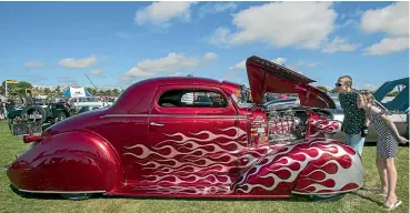  ??  ?? Cody and Abbie Cox check out a 1938 Chevrolet at Caroline Bay on Saturday.