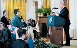  ?? MANDEL NGAN/GETTY-AFP ?? President Trump gets into a heated exchange with CNN’s Jim Acosta, center.