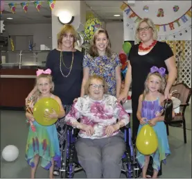  ?? KEVIN PROSSER - ONEIDA HEALTHCARE ?? Mary Rose Durfee, seated center, takes a photo with family members at her 103rd birthday party at the Extended Care Facility in Oneida on Friday.