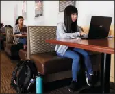  ?? CHRISTINA HOUSE/LOS ANGELES TIMES ?? UCLA student Jessica Kwek, 19, attends a class online at the Bruin Cafe on Wednesday. All classes have been moved to online only.