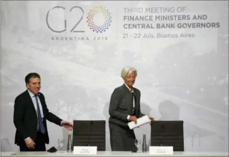  ?? GUSTAVO GARELLO — THE ASSOCIATED PRESS ?? Christine Lagarde, right, Internatio­nal Monetary Fund Managing Director and Argentina Treasury Minister Nicolas Dujovne arrives for a press conference during the G20 meeting of Finance Ministers and Central Bank governors in Buenos Aires, Argentina,...