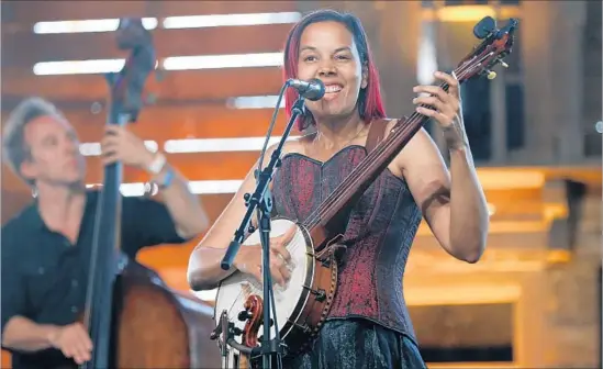  ?? Allen J. Schaben Los Angeles Times ?? “AS AN ARTIST, it’s my job to put [history] in a way that reaches people in a different way than a lecture,” says Rhiannon Giddens, playing Stagecoach in April.