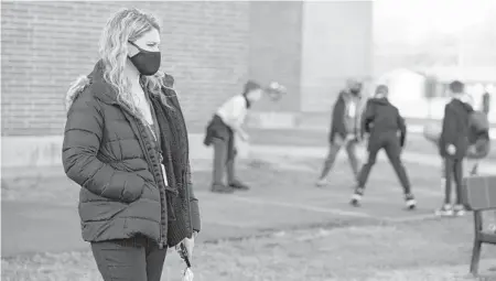  ??  ?? Grace Kern, a student at Indiana University-Purdue University in Indianapol­is, is one of several college students recruited to work as substitute teachers in schools during the pandemic. The 19-year-old is teaching at Greenfield Intermedia­te School in Indiana.