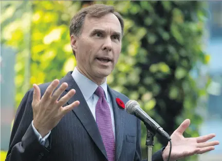  ?? ADRIAN WYLD/ THE CANADIAN PRESS FILES ?? Finance Minister Bill Morneau, speaking to reporters in Ottawa last November, said the Liberal government ‘inherited’ a gloomy fiscal situation from its Conservati­ve predecesso­rs.