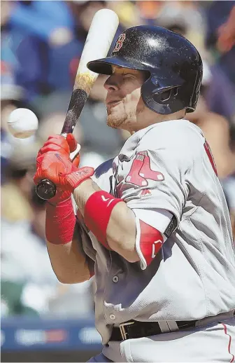  ?? AP PHOTO ?? WEAR IT WELL: Christian Vazquez grimaces after being hit by a pitch during the fifth inning of yesterday’s Red Sox loss in Detroit. Vazquez was plunked twice.