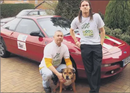  ??  ?? charity drive: Mick White and his son Joe, pictured here with Charlie the dog, are setting off on a 2,000 mile drive to raise money for Wood Green next month.