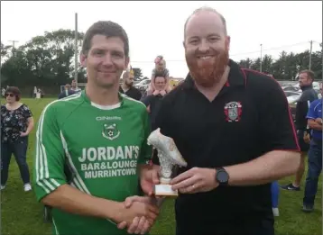  ??  ?? Golden Boot winner Anthony Hayes of Forth Celtic, who received his award from League Treasurer, Ger Cruise.
