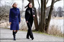  ?? PAUL WENNERHOLM/TT NEWS AGENCY/AFP VIA GETTY IMAGES ?? Swedish Prime Minister Magdalena Andersson, left, and Finnish Prime Minister Sanna Marin walk together prior to a meeting on whether to seek NATO membership, in Stockholm, Sweden on April 13.