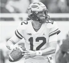  ?? RAJ MEHTA/USA TODAY SPORTS ?? Michigan quarterbac­k Cade McNamara has completed 62.5% of his passes with nine touchdowns and two intercepti­ons.