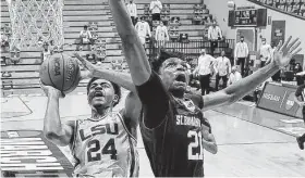  ?? Stacy Revere / Getty Images ?? LSU freshman Cameron Thomas, left, scored 27 points to lead the Tigers past St. Bonaventur­e on Saturday at Bloomingto­n, Ind.