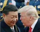  ?? ANDY WONG — THE ASSOCIATED PRESS FILE ?? U.S. President Donald Trump, right, chats with Chinese President Xi Jinping during a welcome ceremony at the Great Hall of the People in Beijing.