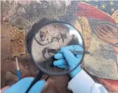  ?? MARTIN MEJIA/THE ASSOCIATED PRESS ?? An art restorer works on a 17th century painting in a studio at the Restoratio­n Center in Cuzco, Peru.