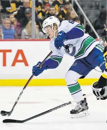  ?? JUSTIN BERL/GETTY IMAGES ?? Brock Boeser of the Canucks scores a goal against the Pittsburgh Penguins on Wednesday. Before Friday’s loss to the Devils, the winger scored at least one goal in four consecutiv­e outings.