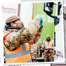  ??  ?? SELFLESS: A soldier gives a trucker a Covid test and, right, a packed M20