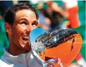  ?? ERIC GAILLARD/REUTERS ?? FANTASTIS: Rafael Nadal menjadi kampiun Monte Carlo Masters 2018. Dia mengalahka­n Kei Nishikori (Jepang) di final tadi malam WIB.