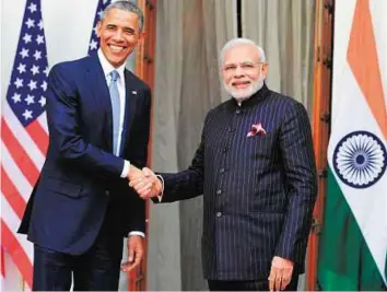  ?? Rex Features ?? Suit up President Barack Obama and Prime Minister Narendra Modi in New Delhi. Modi has, since coming into office, sported some flamboyant clothing.