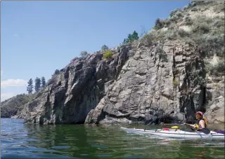  ?? J.P. SQUIRE PHOTOS/Special to The Okanagan Weekend ?? If you head north from Penticton or Naramata along the east shore of Okanagan Lake, you will come across a series of interestin­g rock formations. If you want a longer or even an overnight paddle, you can continue north to a series of campsites in Okanagan Mountain Provincial Park.