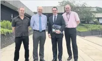  ??  ?? Visit Dean Lockhart (second right) learns more about Stirling University’s Institute of Aquacultur­e from (left) Dr Simon MacKenzie, Professor Malcolm MacLeod and James Dick