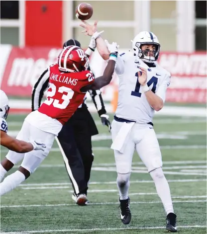  ?? GETTY IMAGES ?? Penn State quarterbac­k Sean Clifford is hit by Indiana cornerback Jaylin Williams as he tries to pass Saturday.