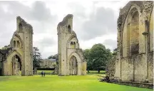  ?? CARRIE SHEPHERD ?? The ruins of Glastonbur­y Abbey still feel mysterious­ly alive amid lush parkland.