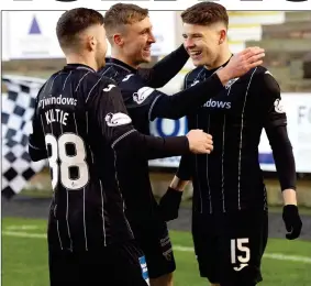  ?? ?? ON THE SPOT: Kevin Nisbet (right) takes the praise after netting his first penalty