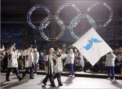  ?? The Associated Press ?? It’s not the first time the Koreas have made a display of unity at the Olympics. North and South Korean athletes also marched together at the 2006 Games opening ceremony in Turin, Italy.