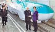  ??  ?? PM Narendra Modi with his Japanese counterpar­t Shinzo Abe in front of a Shinkansen train during their inspection of a bullet train manufactur­ing plant in Kobe, Hyogo prefecture on Nov 12, 2016. AFP